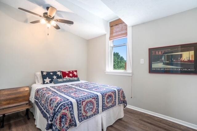 bedroom featuring dark hardwood / wood-style floors and ceiling fan