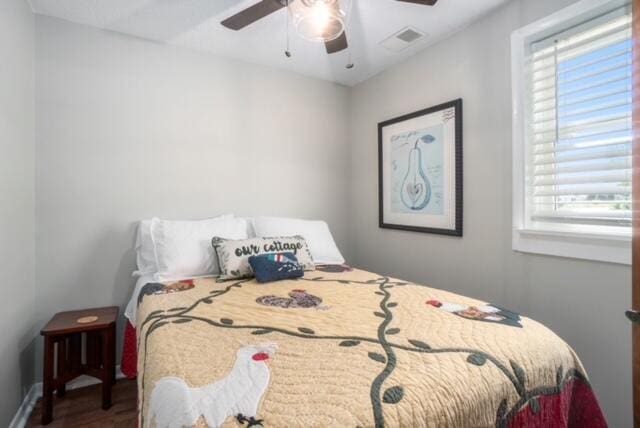 bedroom featuring hardwood / wood-style flooring and ceiling fan