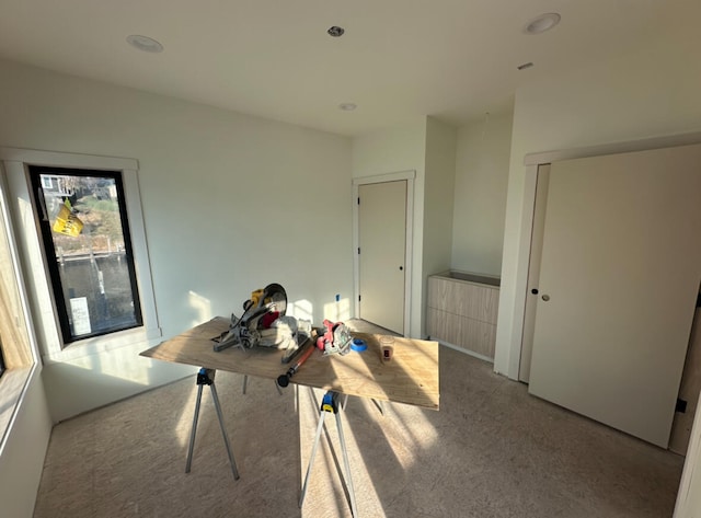 unfurnished office with light colored carpet