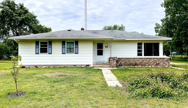 ranch-style house with a front lawn