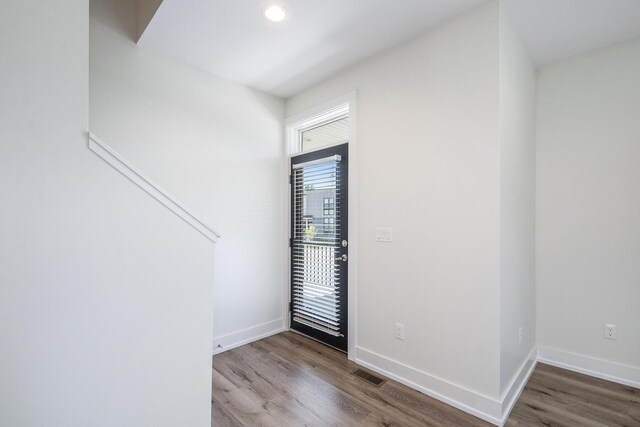 foyer entrance with hardwood / wood-style floors