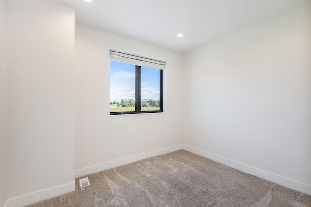 unfurnished room with carpet flooring