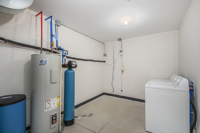 utility room featuring independent washer and dryer and electric water heater