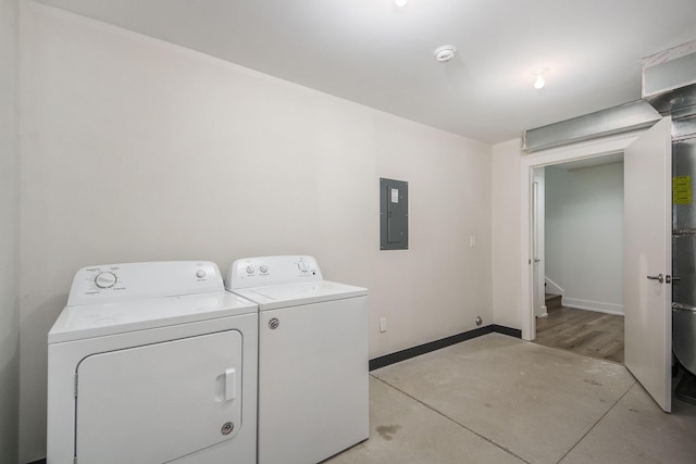 laundry area with independent washer and dryer and electric panel