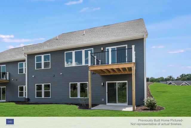 rear view of property with a balcony, a yard, and a patio area