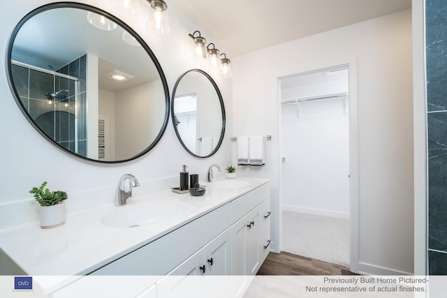 bathroom featuring vanity and hardwood / wood-style floors