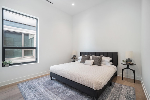 bedroom with wood-type flooring