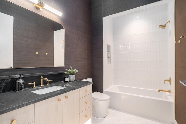 full bathroom featuring toilet, vanity, tile patterned floors, and shower / bathing tub combination