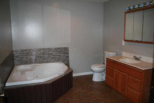 bathroom with vanity, toilet, and a bathing tub