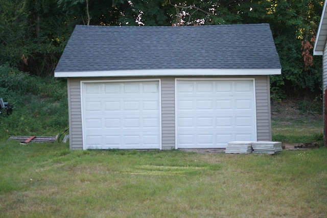 garage with a lawn