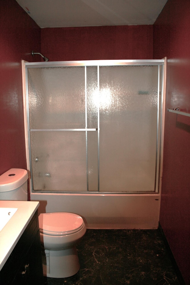 full bathroom with vanity, toilet, and combined bath / shower with glass door