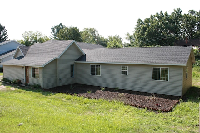 view of property exterior with a lawn