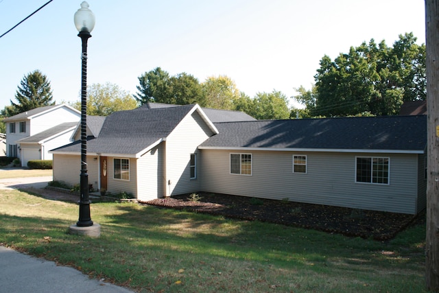 view of home's exterior with a lawn