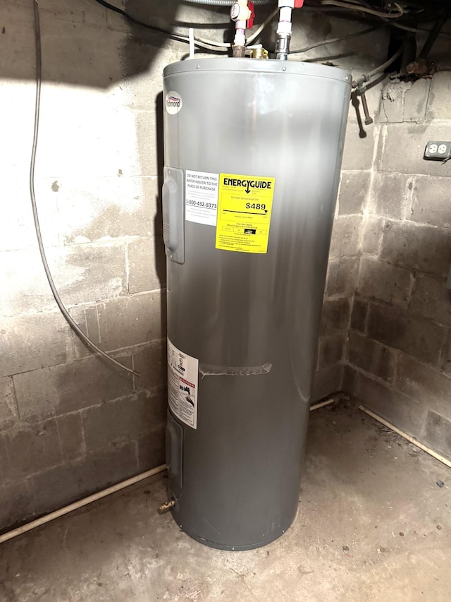 utility room featuring electric water heater