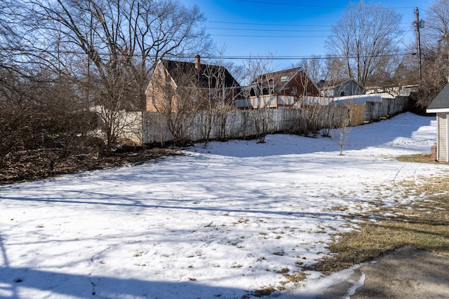 view of yard layered in snow