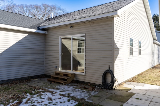 view of property exterior with a patio area