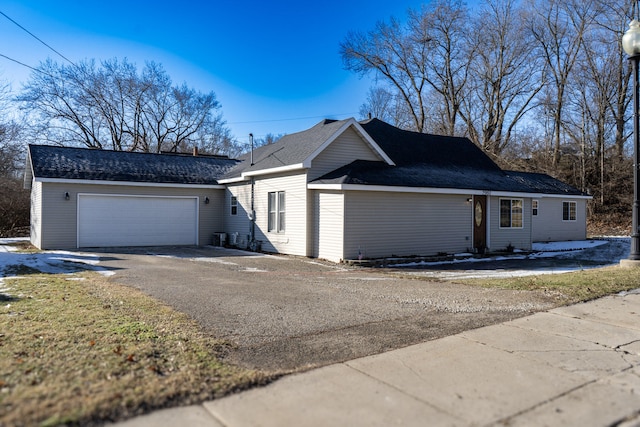 ranch-style home with a garage