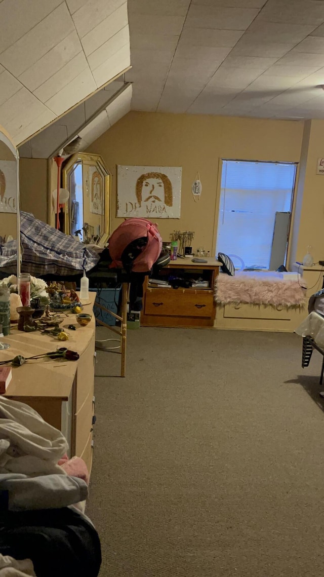 carpeted bedroom featuring lofted ceiling