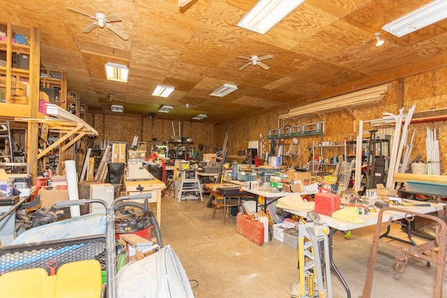 miscellaneous room with ceiling fan and a workshop area