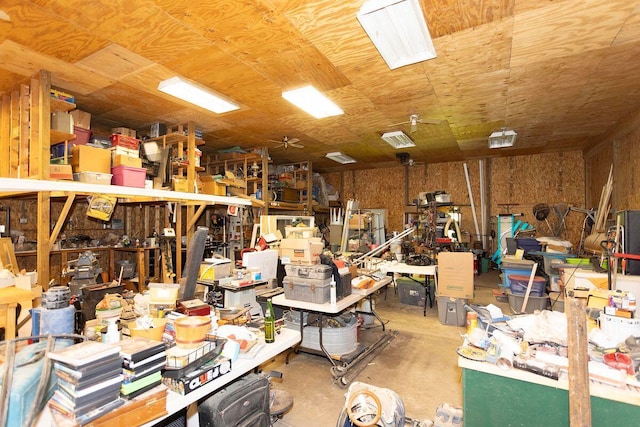 miscellaneous room featuring concrete flooring and a workshop area