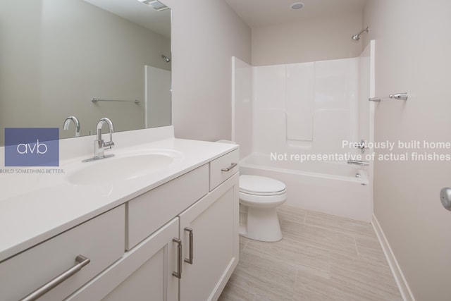 full bathroom featuring vanity, tub / shower combination, and toilet