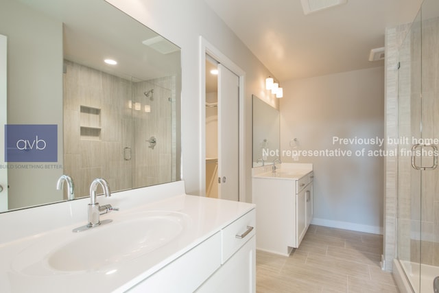 bathroom with walk in shower and vanity