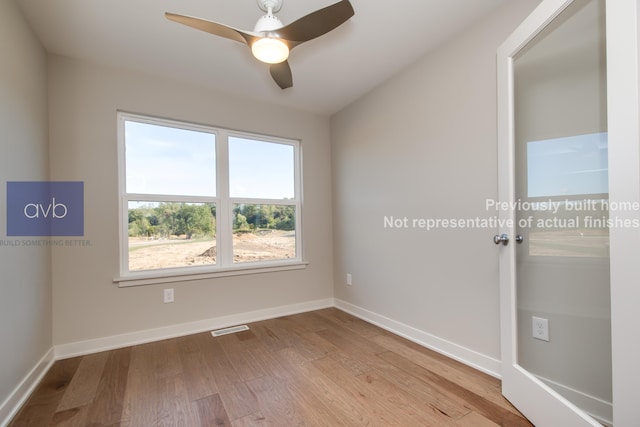 empty room featuring light hardwood / wood-style flooring and ceiling fan