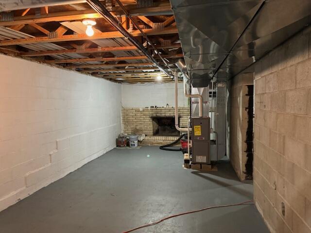 basement featuring heating utilities