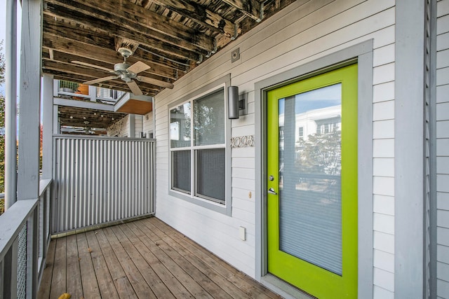 wooden terrace featuring ceiling fan