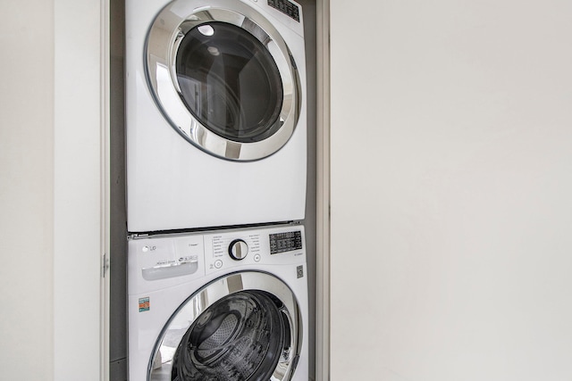 laundry room featuring stacked washer / dryer