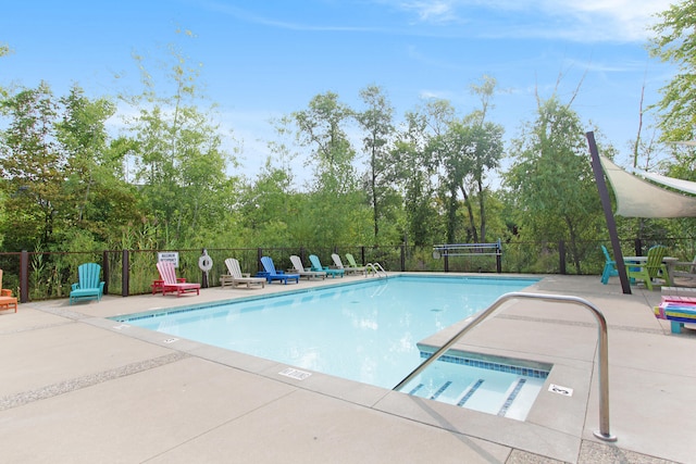 view of swimming pool featuring a patio area