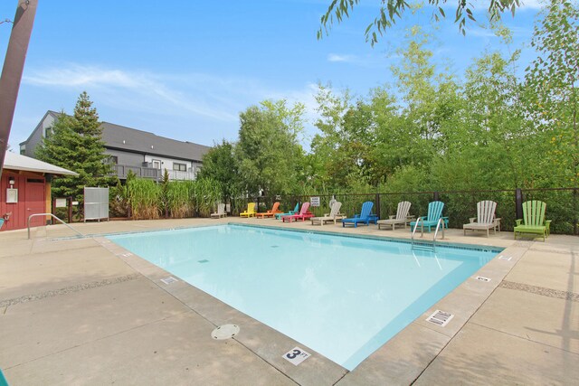 view of swimming pool with a patio