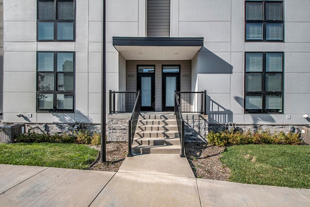 property entrance featuring cooling unit