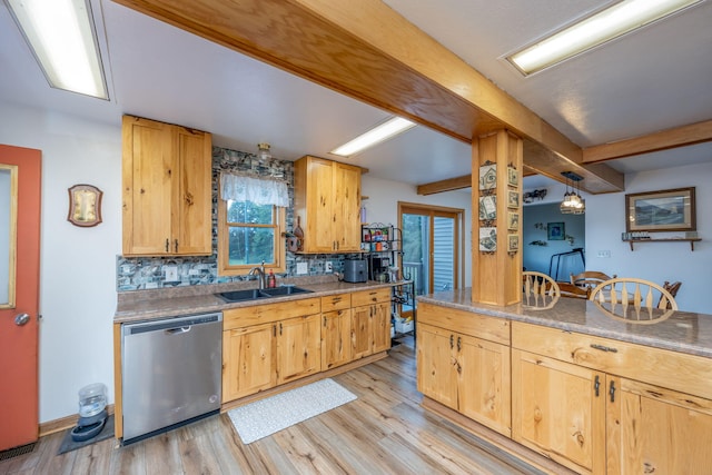 kitchen featuring sink, stainless steel dishwasher, pendant lighting, light hardwood / wood-style floors, and decorative backsplash