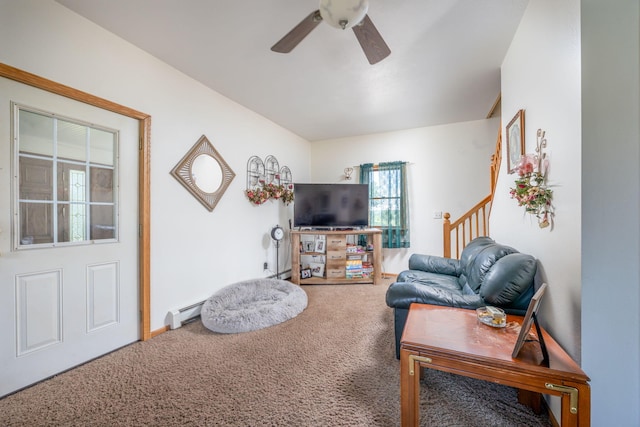 living room with a baseboard radiator, ceiling fan, and carpet flooring