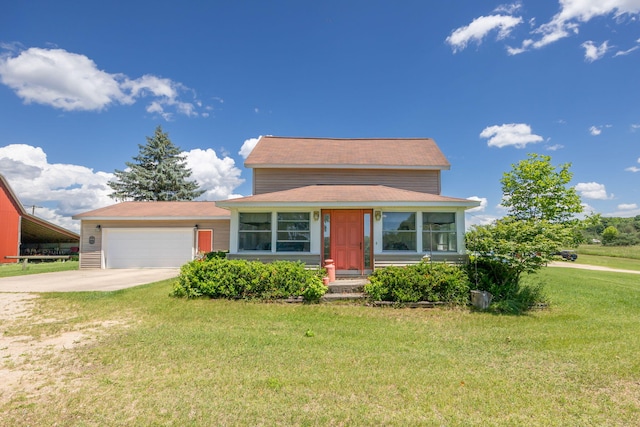 view of front of home with a garage and a front lawn