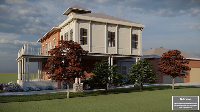 view of front of house with a front lawn and a balcony