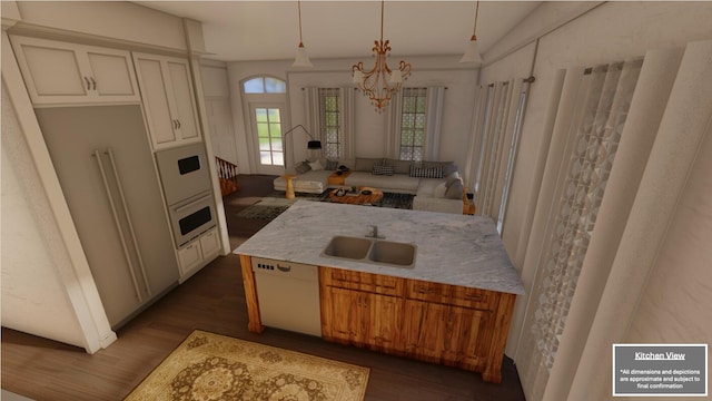 kitchen with dark wood-type flooring, white appliances, a sink, and light stone countertops