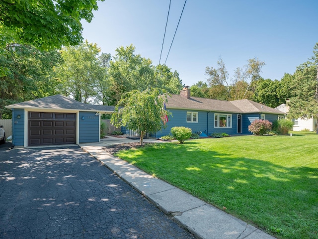 single story home featuring a front lawn and a garage