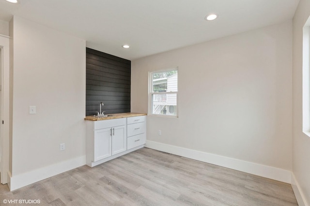 interior space with sink and light wood-type flooring