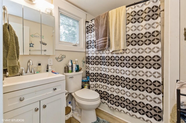 bathroom featuring a shower with curtain, vanity, hardwood / wood-style floors, and toilet