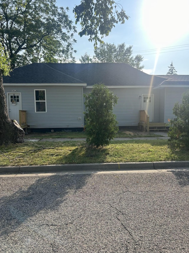 view of home's exterior with a lawn