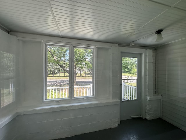 unfurnished sunroom with plenty of natural light