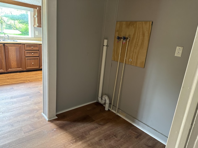 interior space with sink and light wood-type flooring