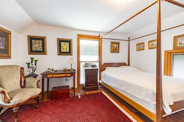 bedroom featuring wood-type flooring and lofted ceiling