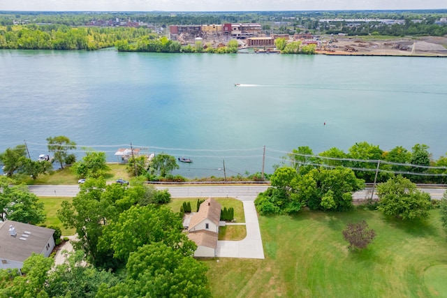 birds eye view of property with a water view