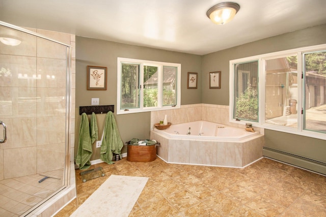 bathroom with a baseboard heating unit and shower with separate bathtub