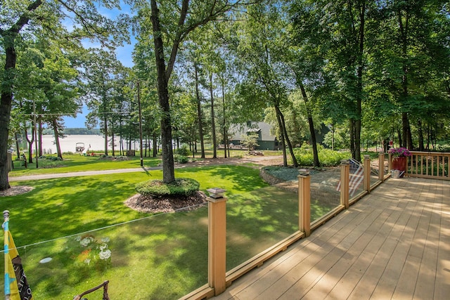 exterior space featuring a lawn and a water view