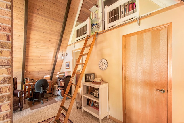 office space with vaulted ceiling with beams, wood ceiling, and carpet