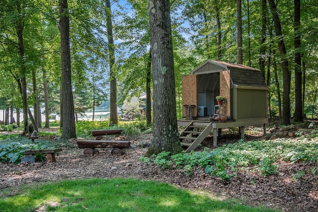 view of yard with cooling unit and a storage unit